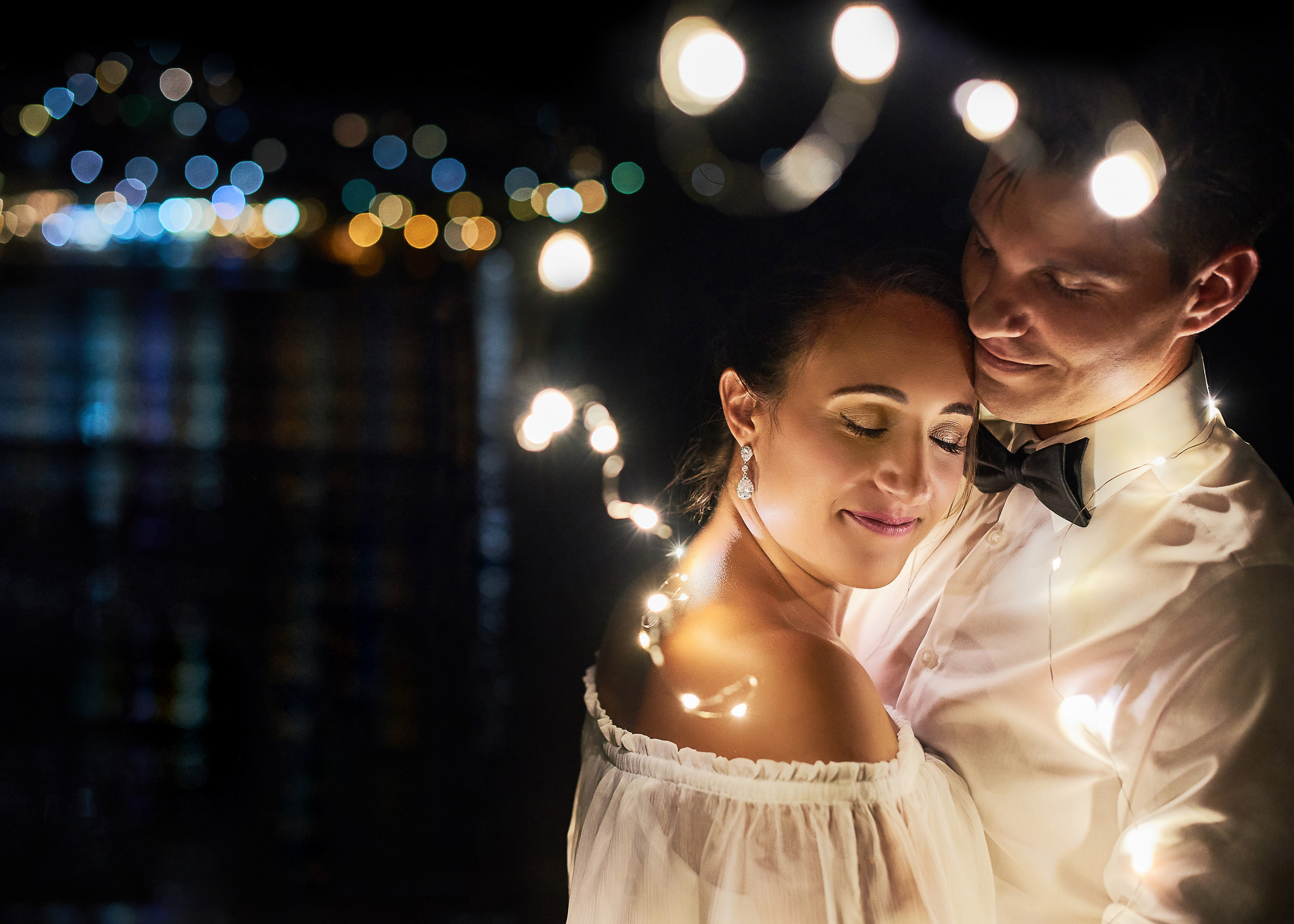 https://cliophotography.com/wp-content/uploads/2025/03/Couple-with-lights-s.jpg